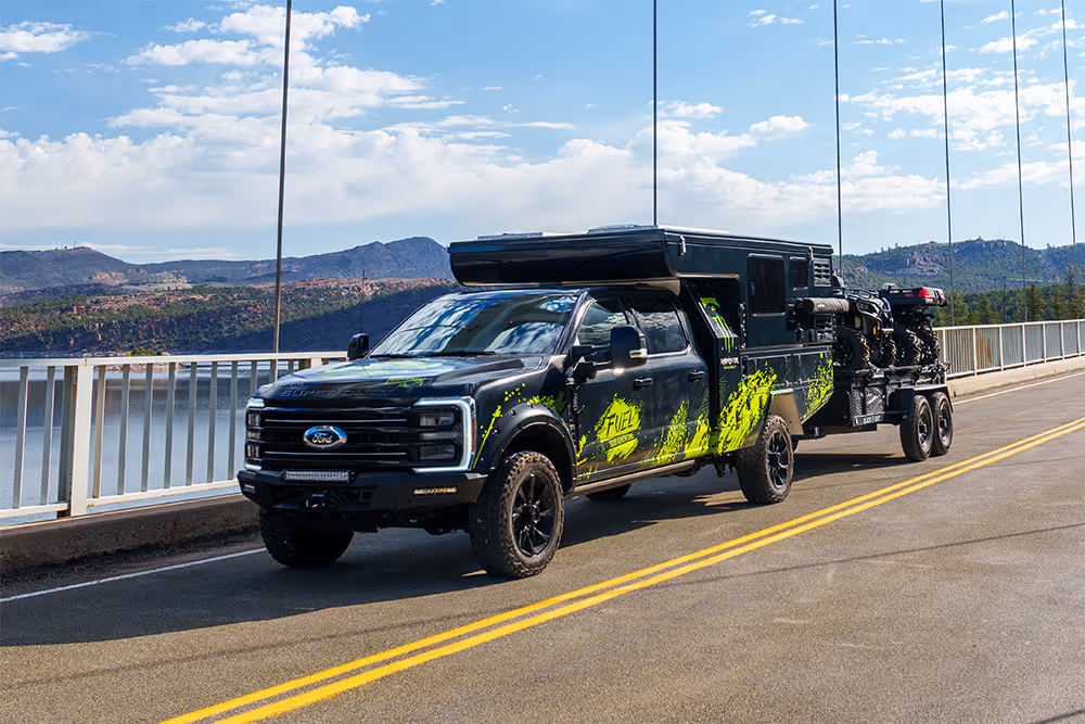 Ford F-250 with a custom camper, two ATVs and a trailer, plus $30,000